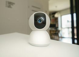 White indoor camera on a pale background