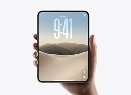 Hand holding a white foldable phone in book mode